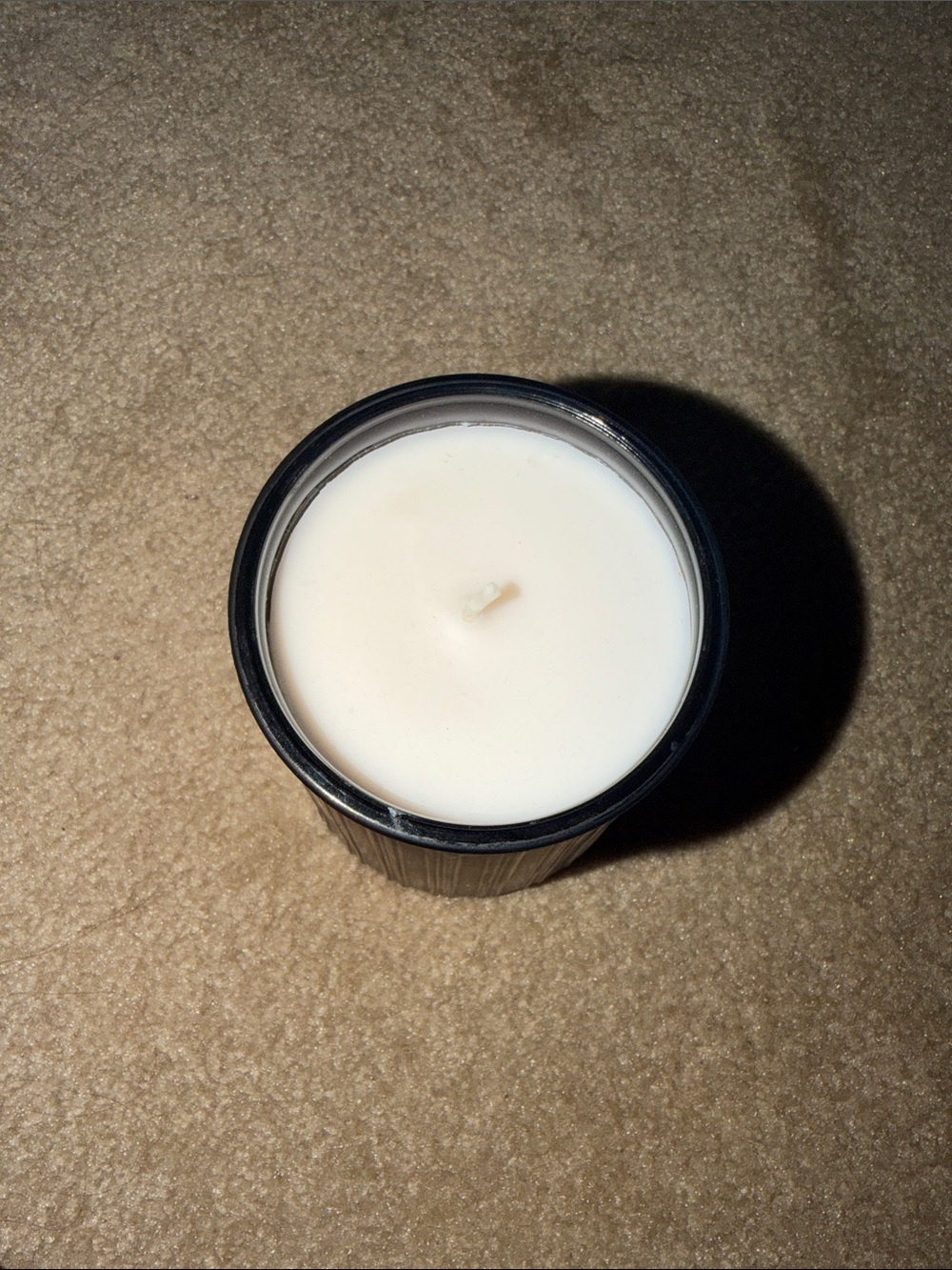 Black/warm leathered Amber White Soy Candle in Black Jar